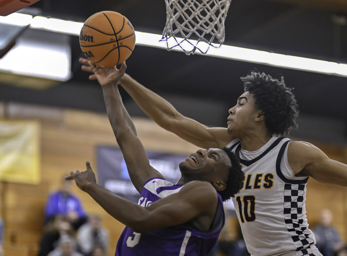 Isaac Williams (10) and St. Augustine's Jaden Bailes (3) battle for loose ball. 